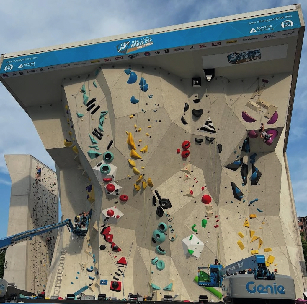 This is the Kletterzenstrum competition wall. Most of the routes are already set, but the setters are still putting up a route on the far left.